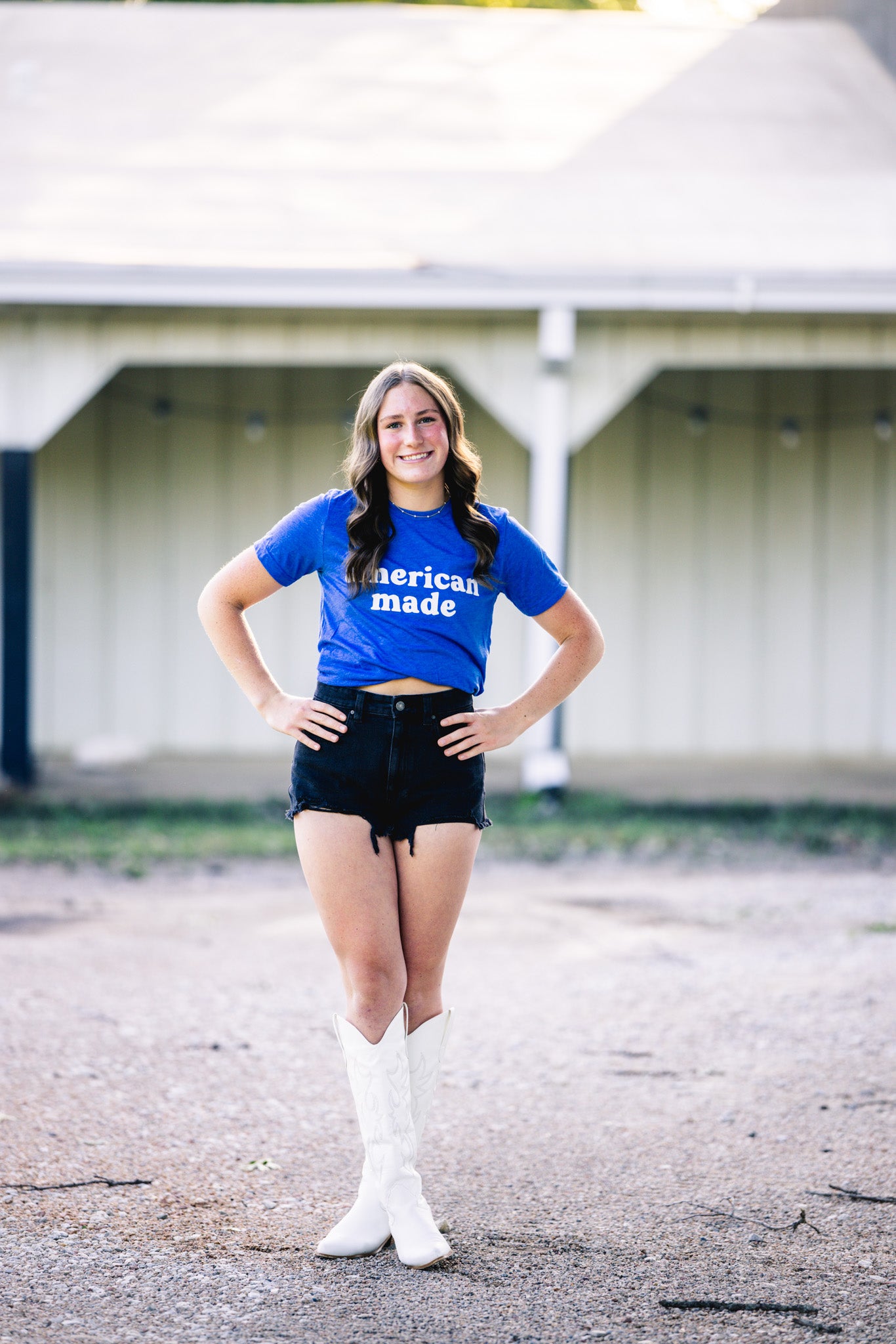 T-shirt with the text "American Made," celebrating patriotism and pride in American craftsmanship and style. Blue Bella and Canvas shirt.