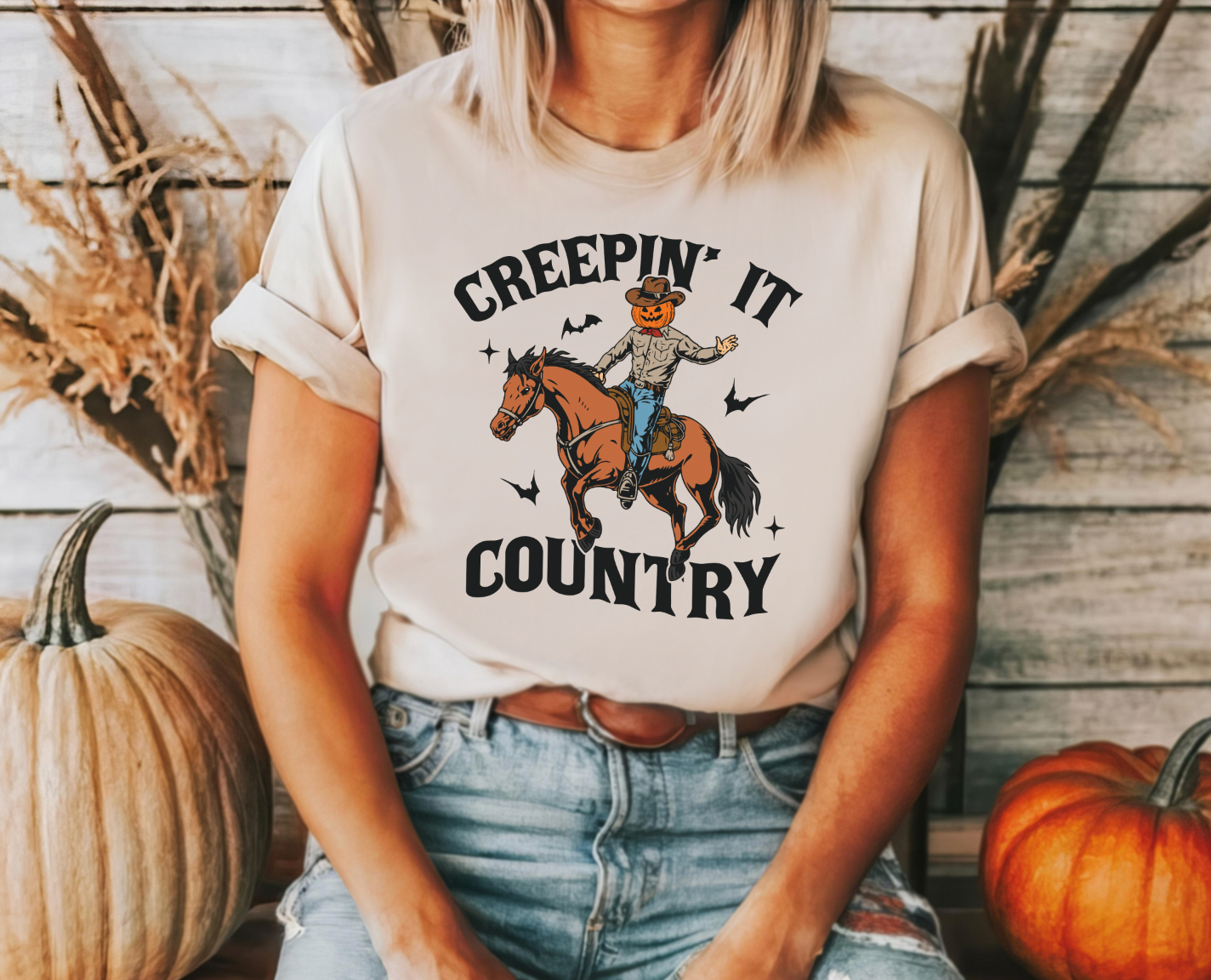 Creepin' It Country shirt with fun design, featuring soft and comfortable fabric, perfect for a spooky and country look. Cream shirt.