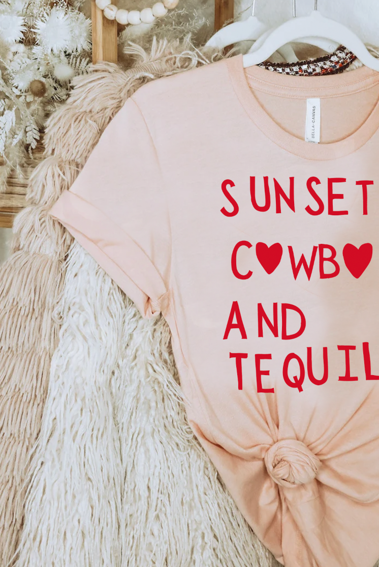 Super soft Bella and Canvas Peach colored vintage country girl tshirt with Sunsets, Cowboys and Tequila on it.