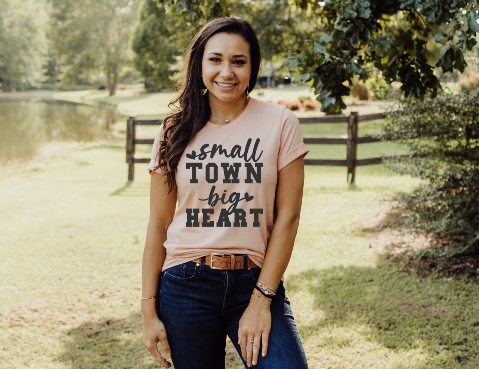 Small Town Big Heart vintage country girl western t-shirt. Unisex T-Shirt from Bella and Canvas in peach.