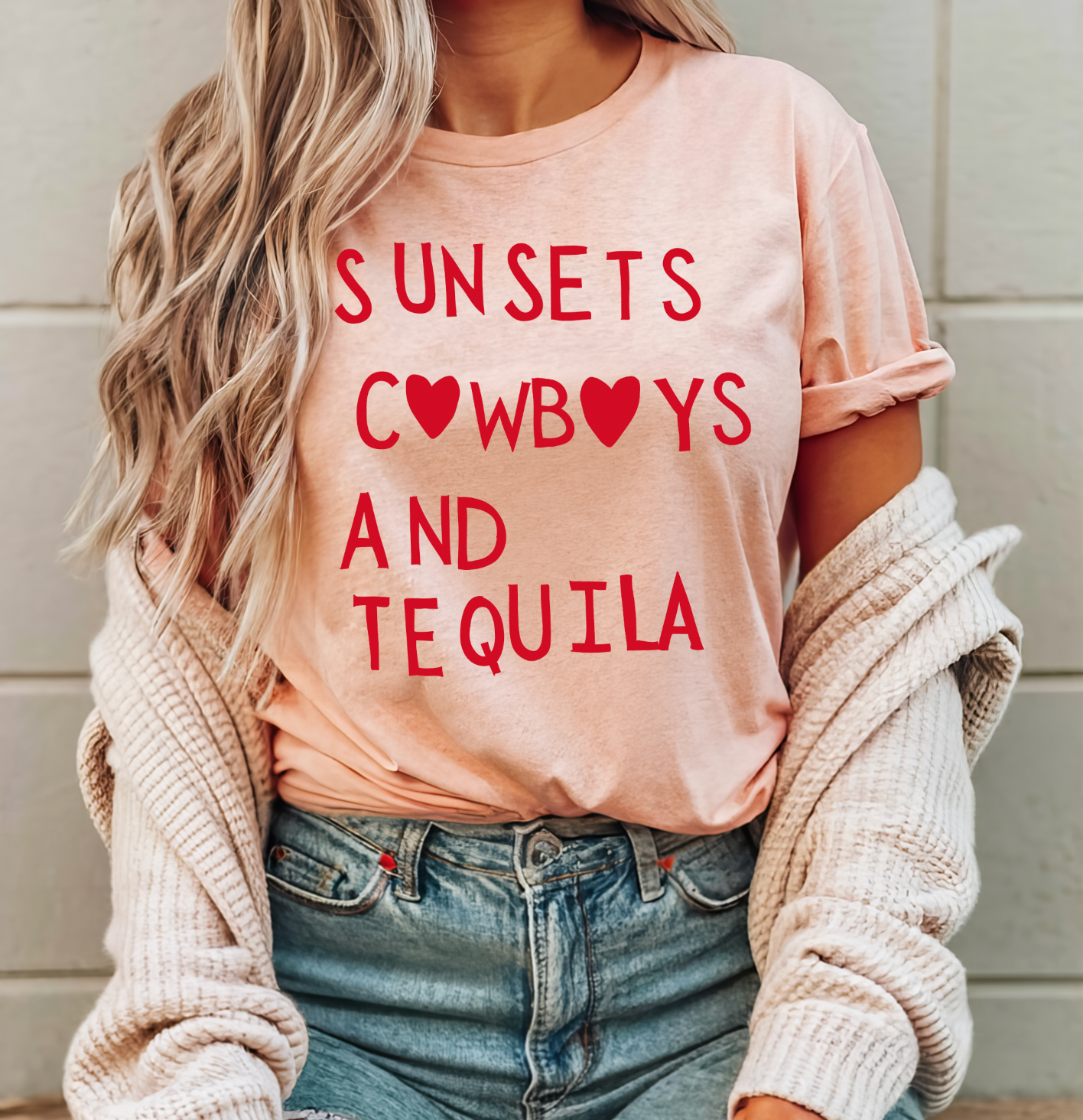 Super soft Bella and Canvas Peach colored vintage country girl tshirt with Sunsets, Cowboys and Tequila on it.