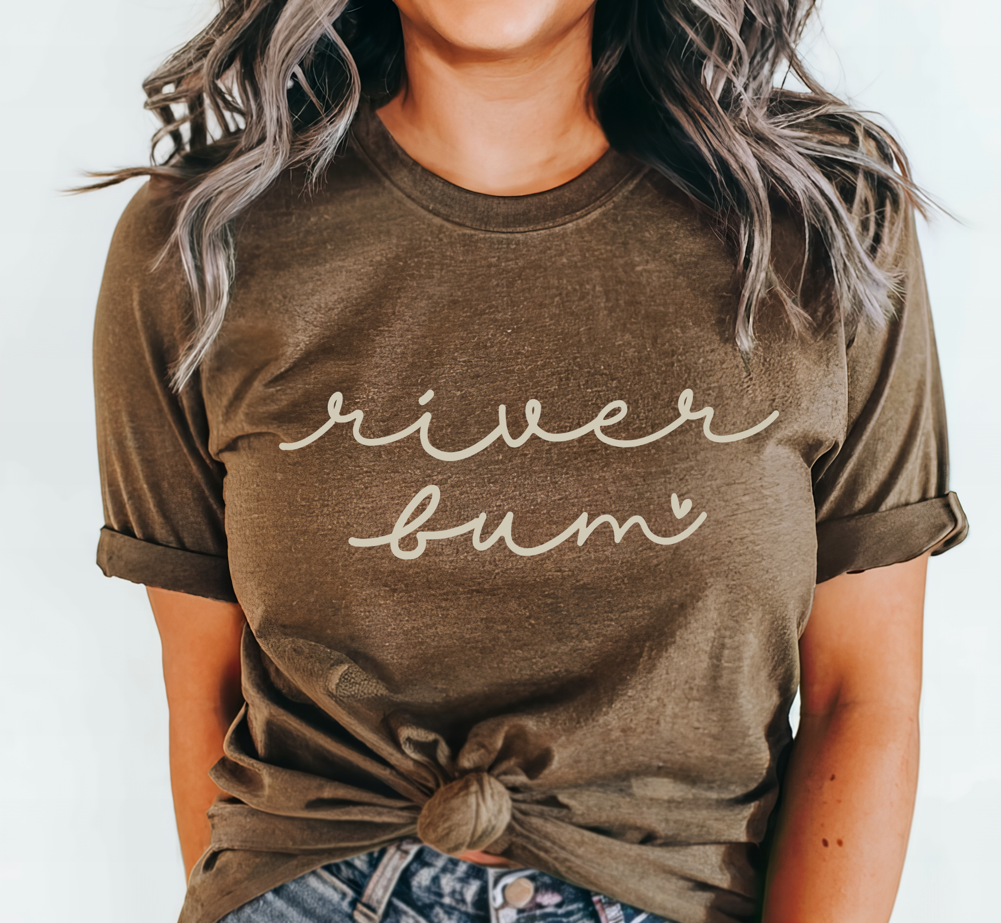 River Bum adorable river shirt on a brown Bella and Canvas shirt featuring a small heart.