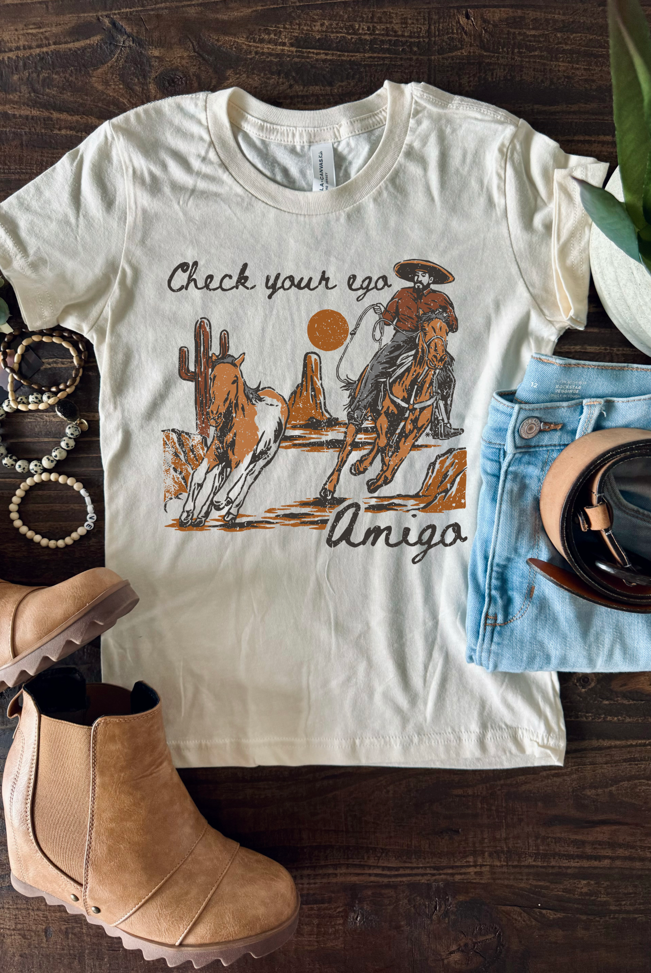 Vintage western country girl tshirt with Check your Ego Amigo on it.