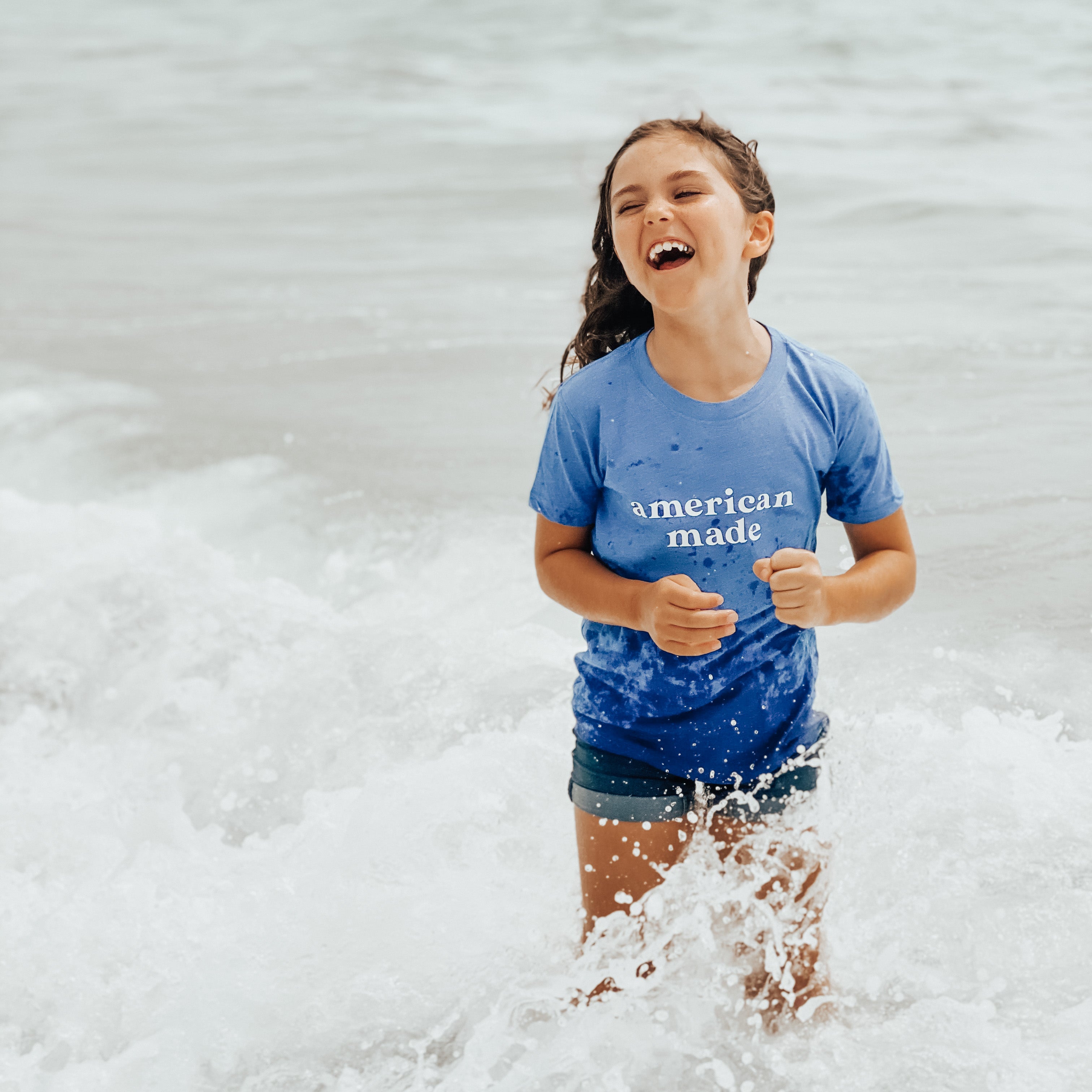 American Made. Bella and Canvas super soft t-shirt proudly made in the USA with ocean vibes. Color shirt for this youth shirt is s heather blue.