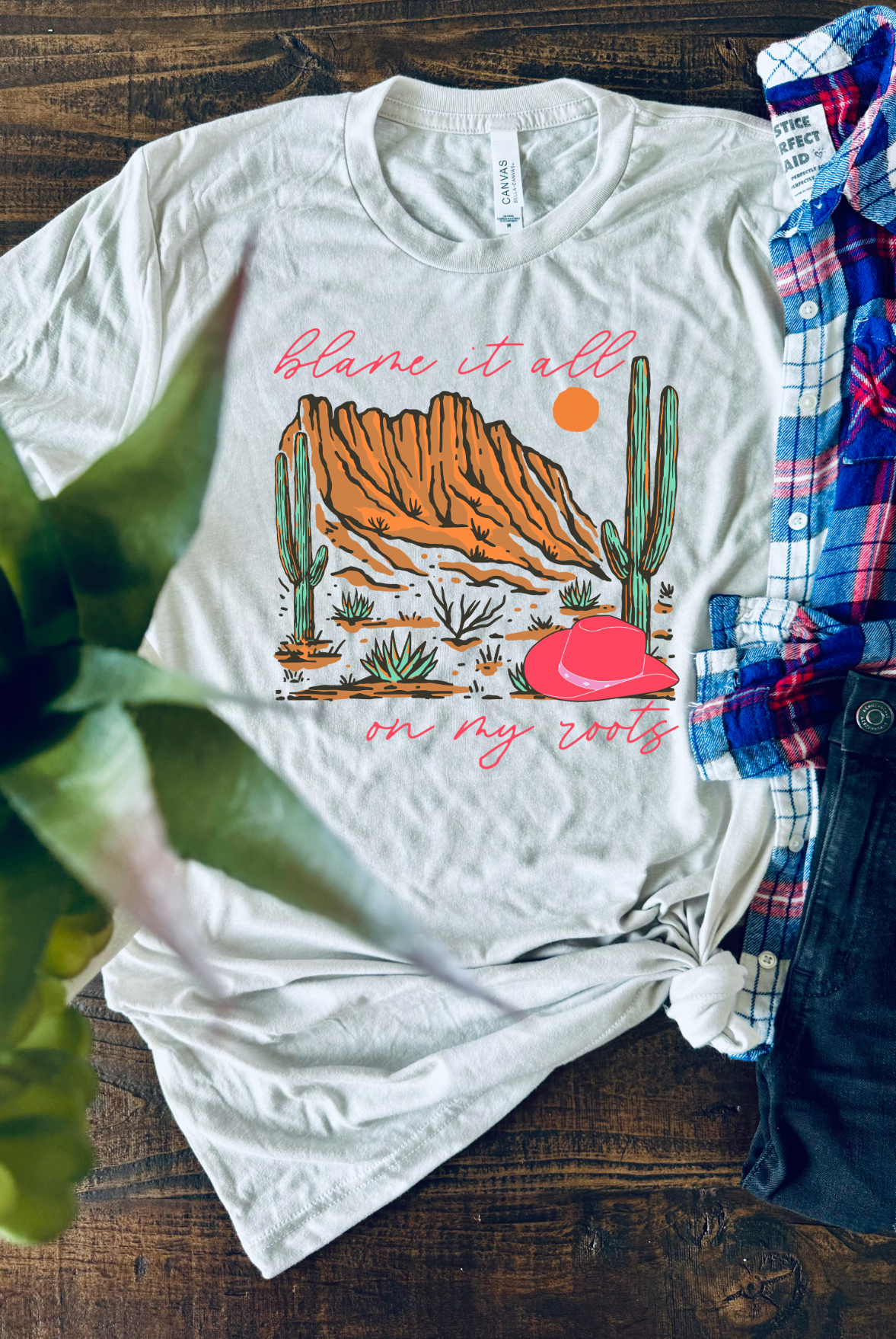 Blame it all on my roots. Bella and Canvas soft tee in Cement. Hand made and shipped from Texas.