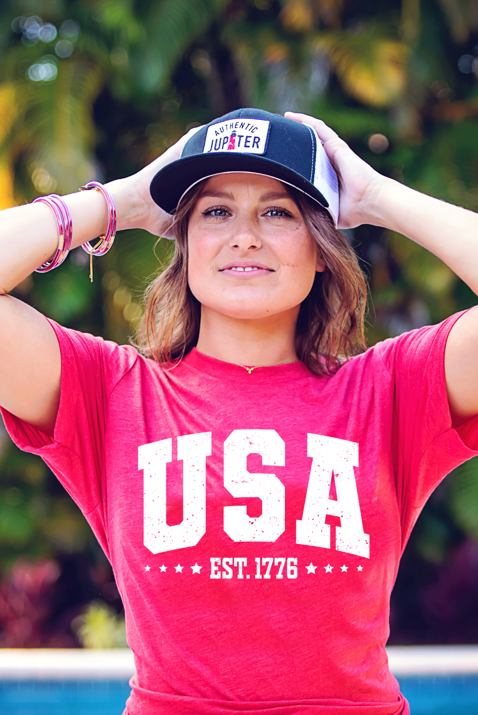 USA Est. 1776 with stars on a classic heathered red Bella and Canvas tshirt. Americana 4th of July graphic tee.