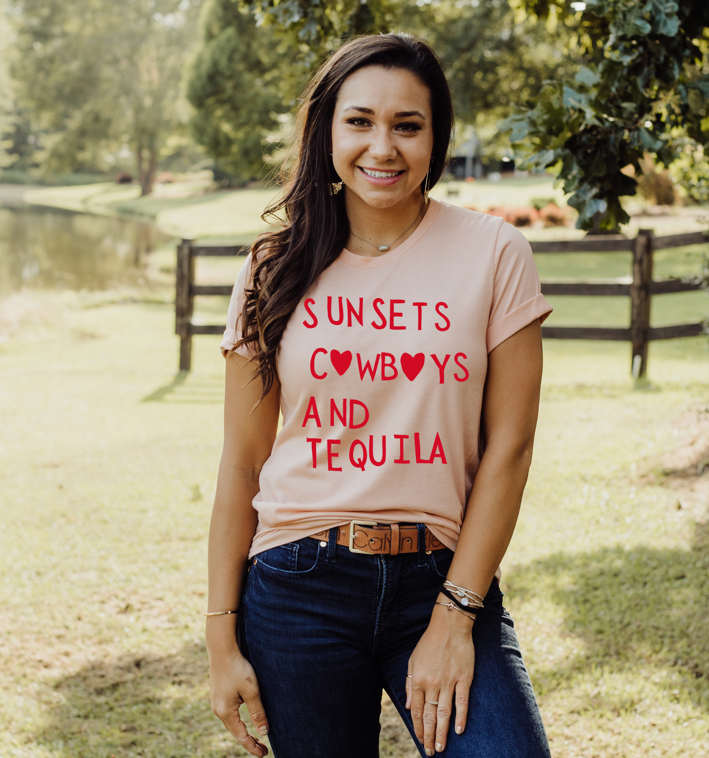 Super soft Bella and Canvas Peach colored vintage country girl tshirt with Sunsets, Cowboys and Tequila on it.