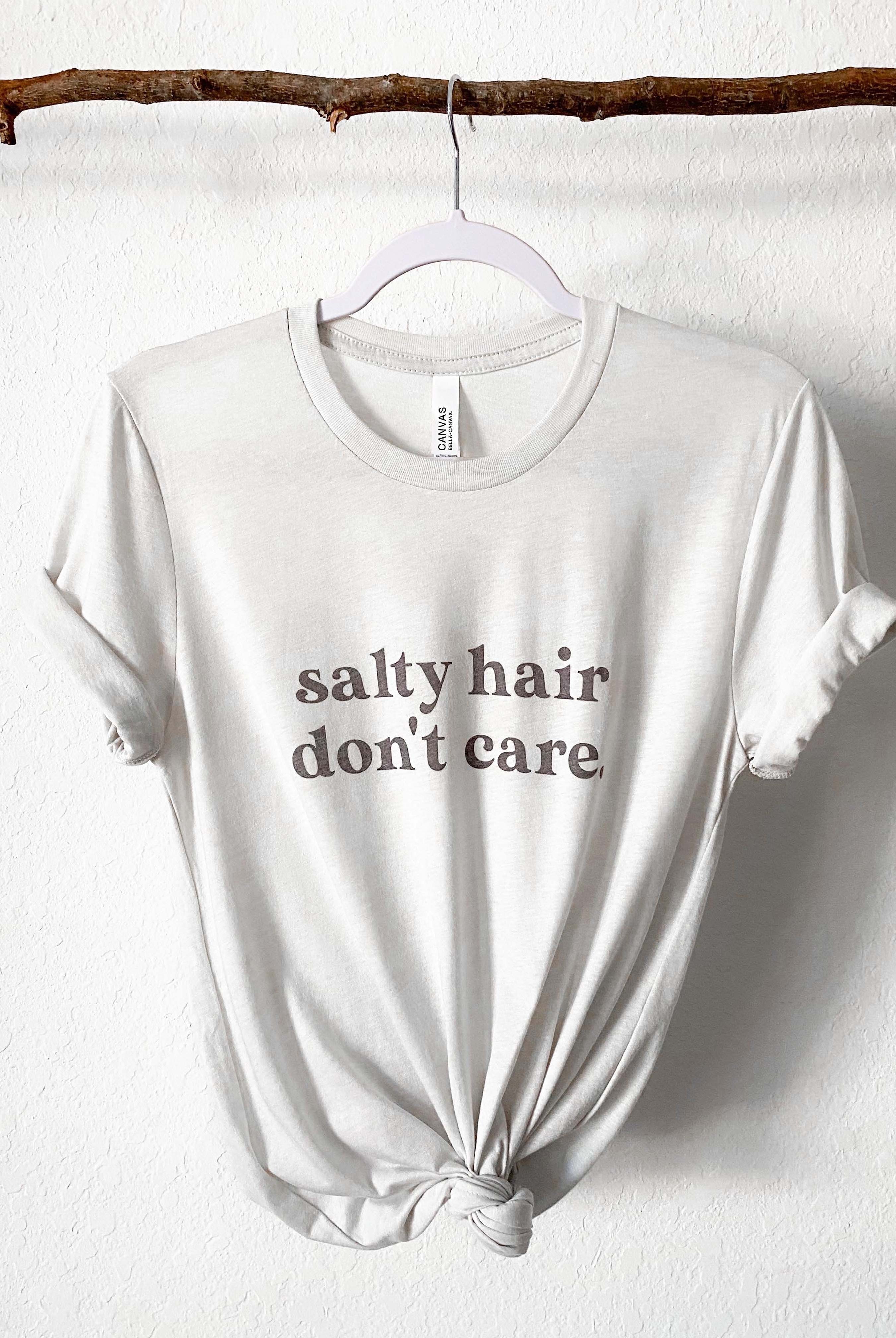 Salty Hair Don't Care super soft beach shirt for summer. Beach girl, ocean girl shirt. Bella and Canvas unisex shirt in Cement Color.