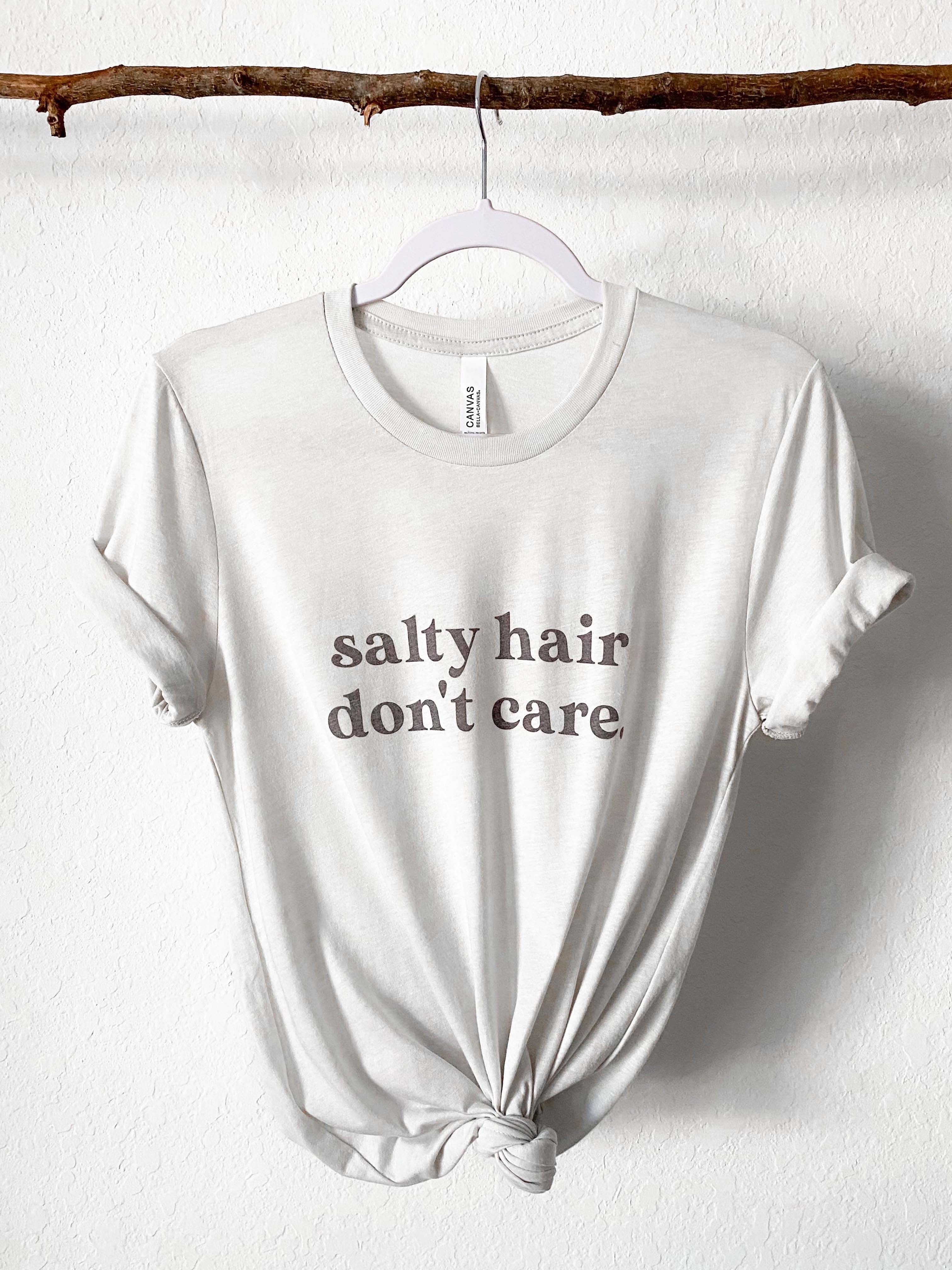 Salty Hair Don't Care super soft beach shirt for summer. Beach girl, ocean girl shirt. Bella and Canvas unisex shirt in Cement Color.