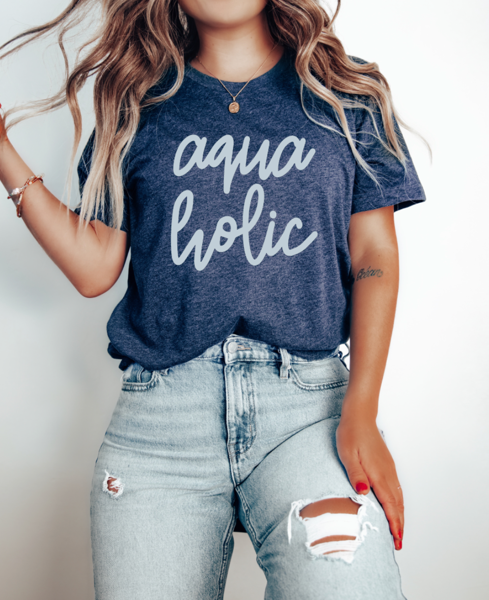 Aquaholic beach girl, summer shirt or tank. Water love Aquaholic design. Heather Navy T-Shirt from Bella and Canvas.
