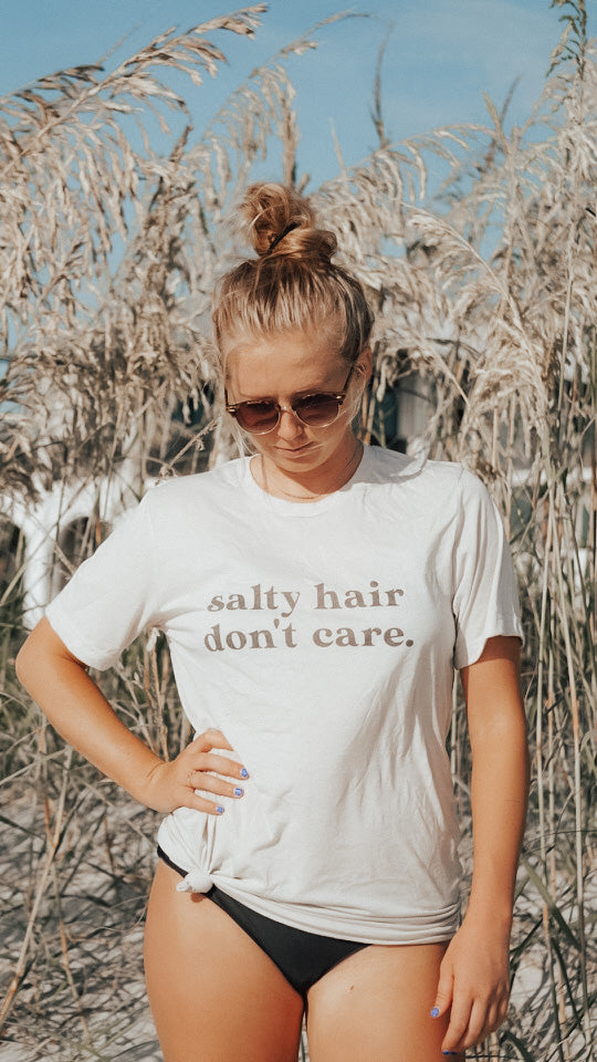 Salty Hair Don't Care super soft beach shirt for summer. Beach girl, ocean girl shirt. Bella and Canvas unisex shirt in Cement Color.