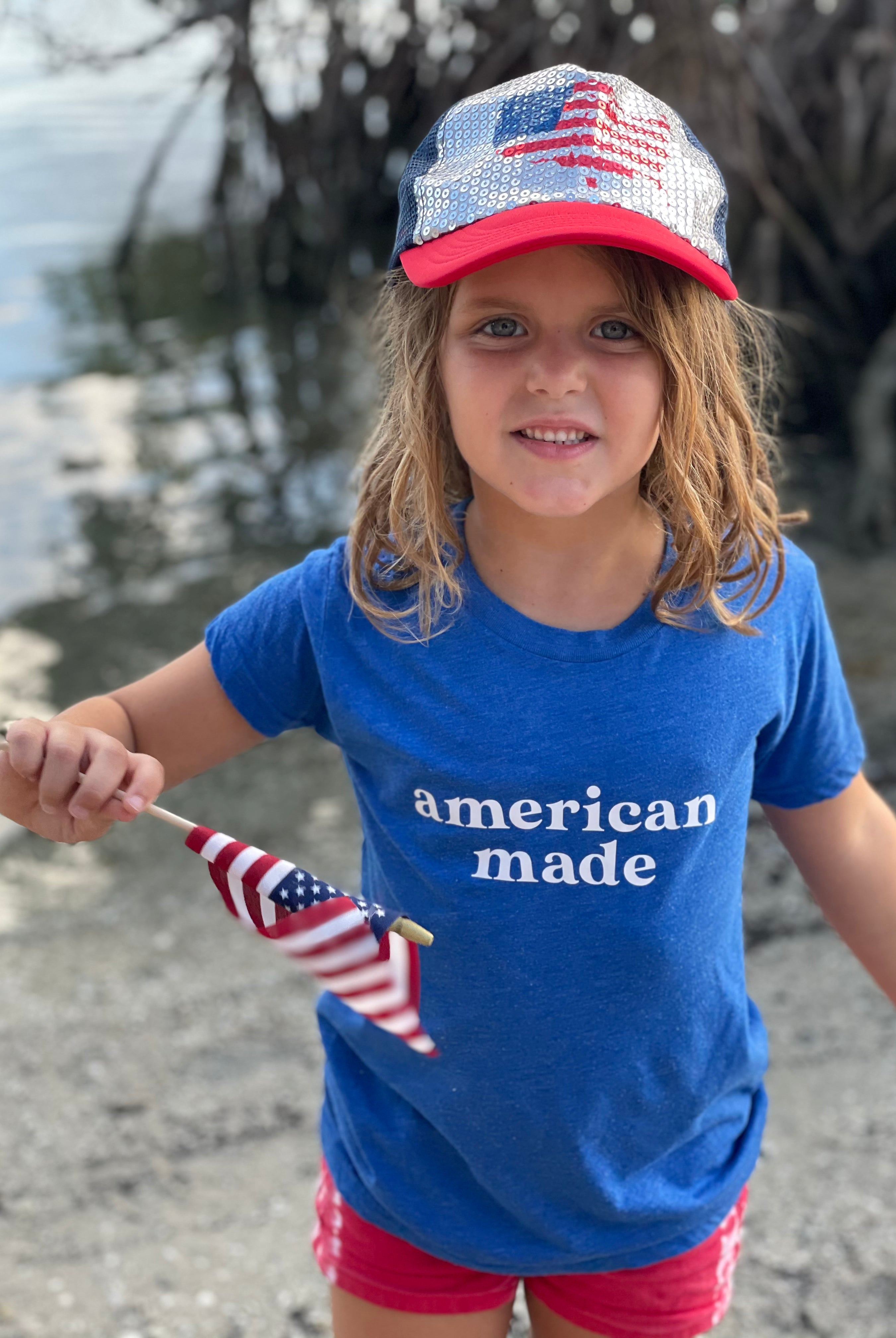 American Made. Bella and Canvas super soft t-shirt proudly made in the USA. Color shirt for this little American cutis is haether blue.