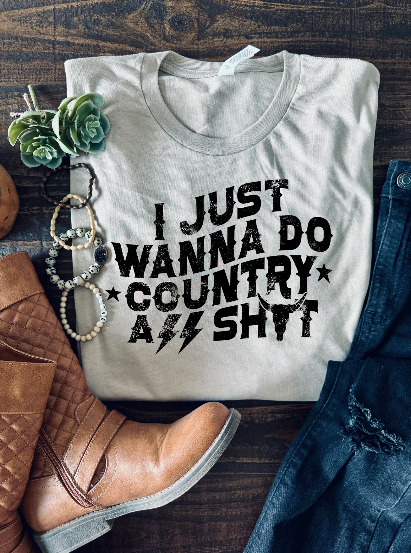 I just wanna do country ass shit, unisex bella and canvas t-shirt featuring stars, lightning bolts and longhorn in tan color.