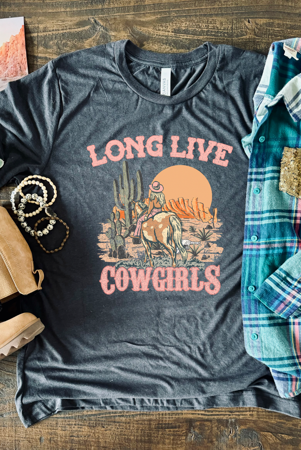 Long Live Cowgirls vintage tee on a super soft charcoal colored unisex tee shown with flannel.