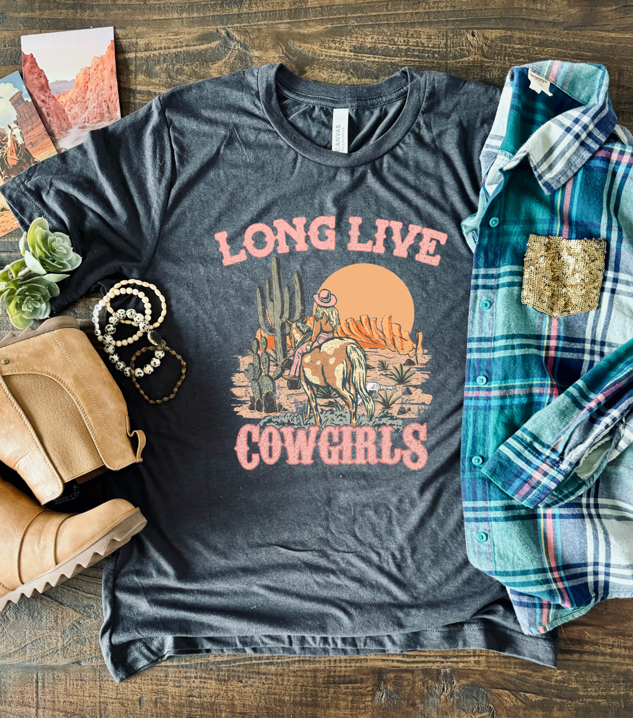 Long Live Cowgirls vintage tee on a super soft charcoal colored unisex tee shown with flannel.