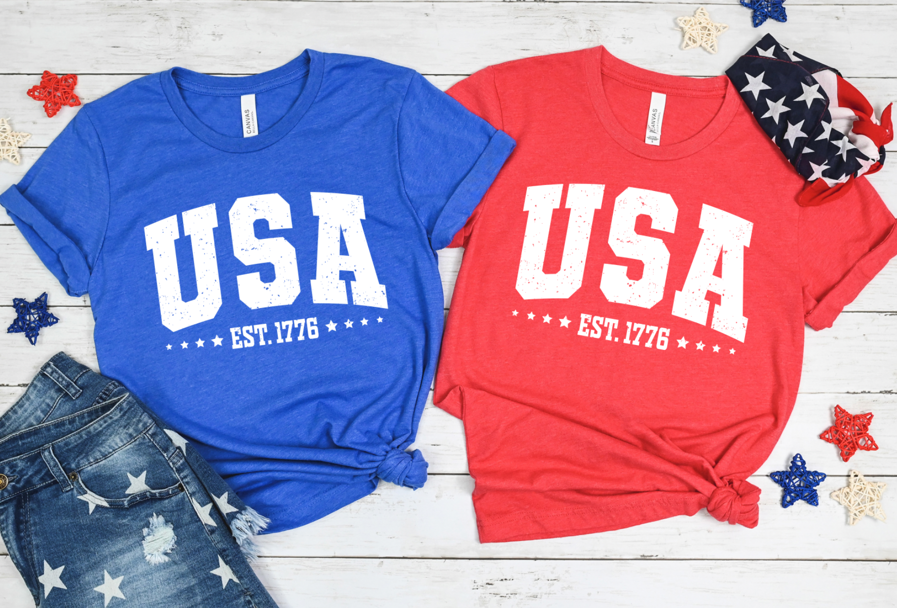 USA Est. 1776 with stars on a classic heathered red and blue Bella and Canvas tshirt. Americana 4th of July graphic tee.