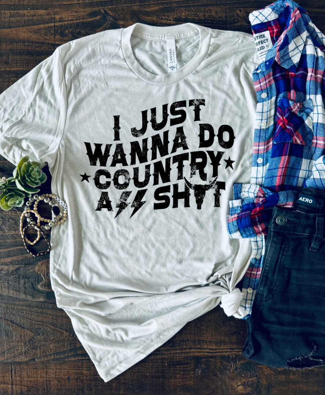 I just wanna do country ass shit, unisex bella and canvas t-shirt featuring stars, lightning bolts and longhorn in cement color.